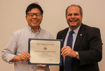 Zhiwei Liu, ACA winner for Research, with President David Glassman by Jay Grabiec