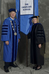 Dr. William L. Perry, President, Dr. Deborah A. Woodley, Faculty Marshal by Beverly J. Cruse