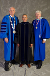 Dr. William L. Perry, President, Dr. Al Bowman, Commencement Speaker, Louis V. Hencken, Past President by Beverly J. Cruse