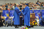 Dr. William L. Perry Conferring the last graduate of the Spring 2015 Commencement, by Beverly J. Cruse