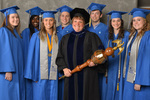 Dr. Melanie Burns, Commencement Marshal & Students by Beverly J. Cruse