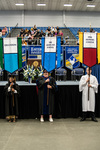 Dr. Sham’ah Md-Yunus, Faculty Marshal, Dr. Jennifer Stringfellow, Faculty Marshal, Mr. Seth Yeakel, Honors College banner by Beverly Cruse