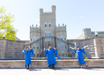 2021 grads pose in front of the Old Main gate by Jay Grabiec