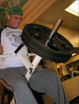 Student Using Weight Machine in Student Recreation Center by Daily Eastern News