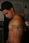 Side Profile of Tattoo Receiver by Daily Eastern News