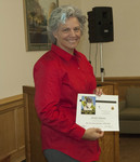 Keynote speaker Sheila Simons displays her certificate of appreciation by Beth Heldebrandt