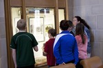 Elementary school kids visit the Parker exhibit by Booth Library
