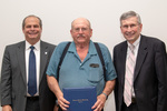 President David Glassman and Paul McCann, Vice President for Business Affairs with Dale McCullough